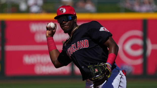 Mar 2, 2024; Goodyear, Arizona, USA; Cleveland Guardians second baseman Angel Martinez (79) throws to first against the Kansas City Royals during the second inning at Goodyear Ballpark.